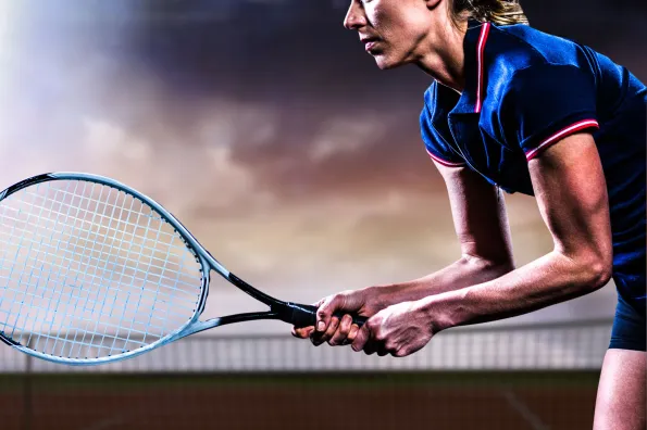 Tennis player holding racket.