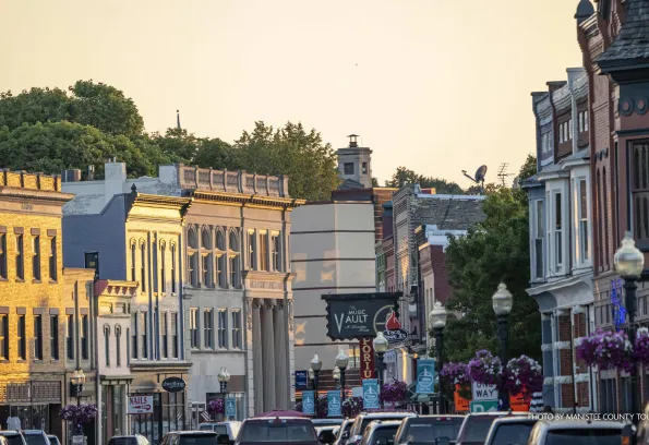 busy shot of downtown michigan main street during sunset.