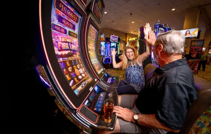 People playing slot machines in Little River Casino Resort