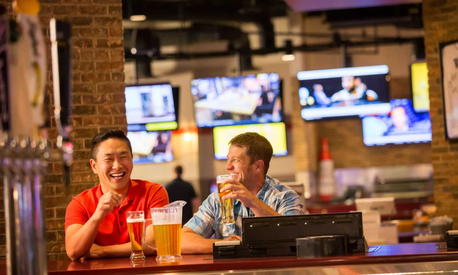 Friends hanging out at River Rock Sportsbook & Grill in Little River Casino Resort