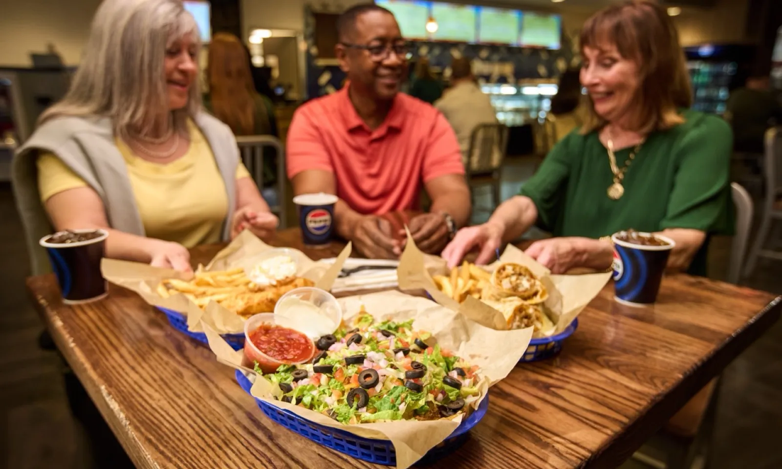 A few people eating nachos