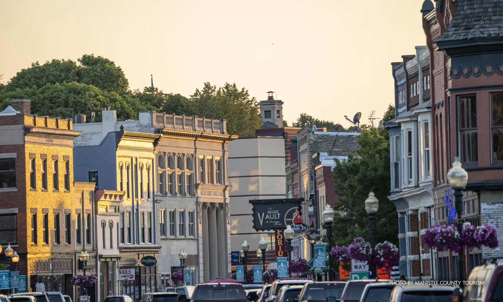 busy shot of downtown michigan main street during sunset.