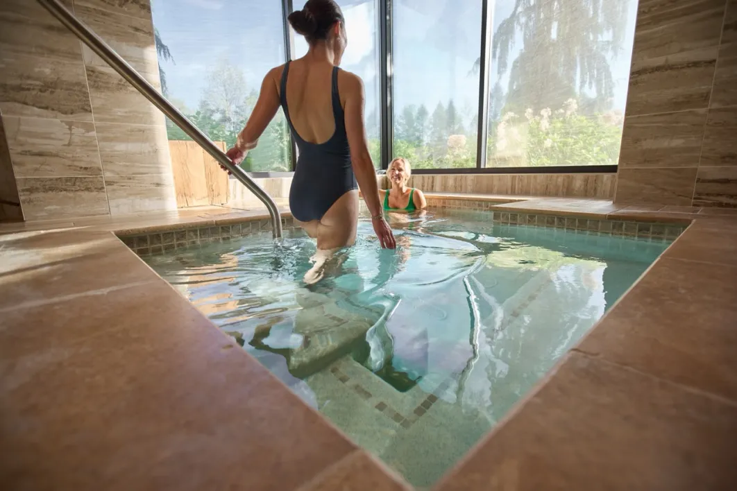 Two women enjoying hot tub